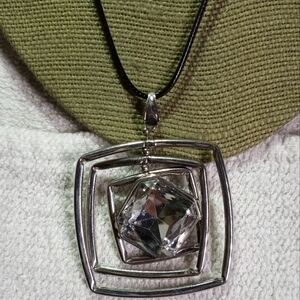Large silvertone Crystal Square movable necklace black cord